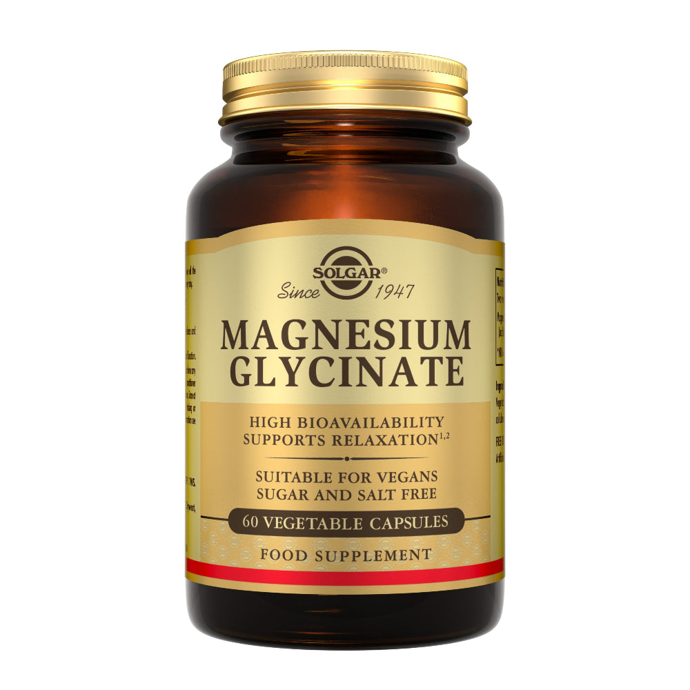 A bottle of Solgar Magnesium Glycinate dietary supplement, featuring an amber glass bottle with a gold cap and a beige label with black and red text.